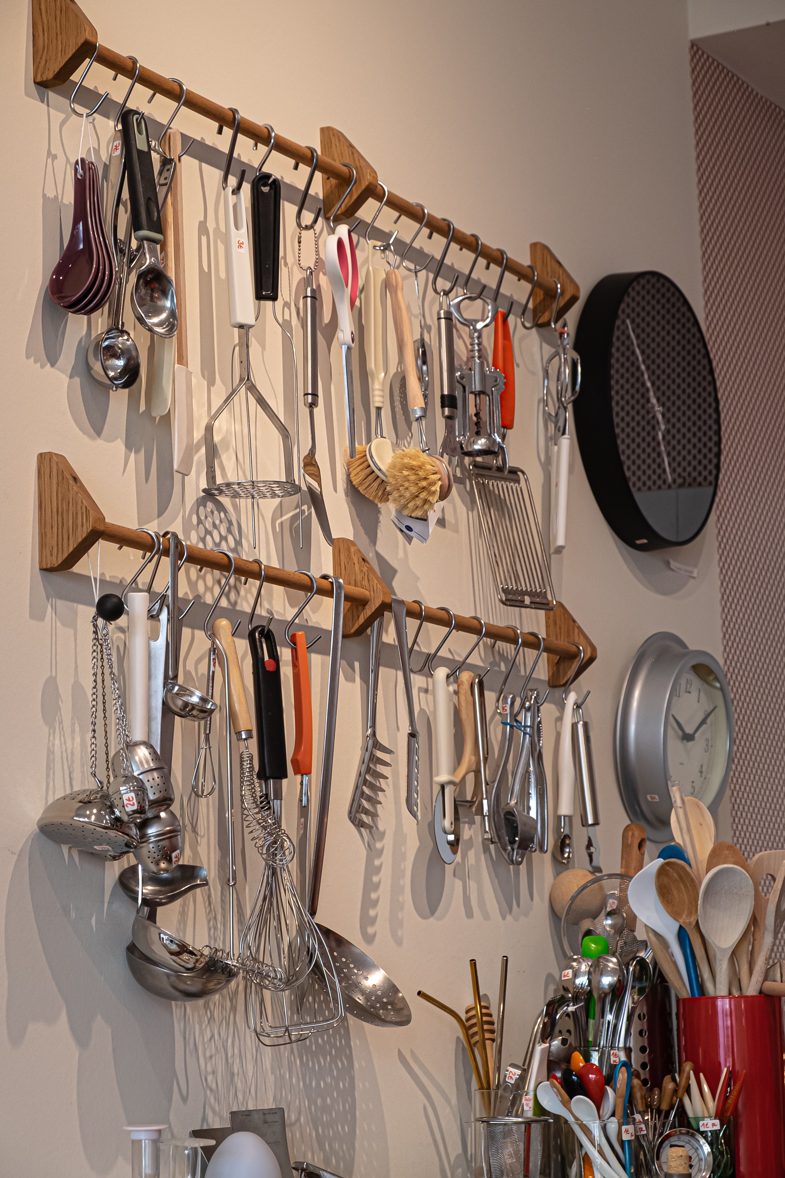 Modern luxury Scandinavian kitchen with wooden island, copper whisk, shears, and digital scale